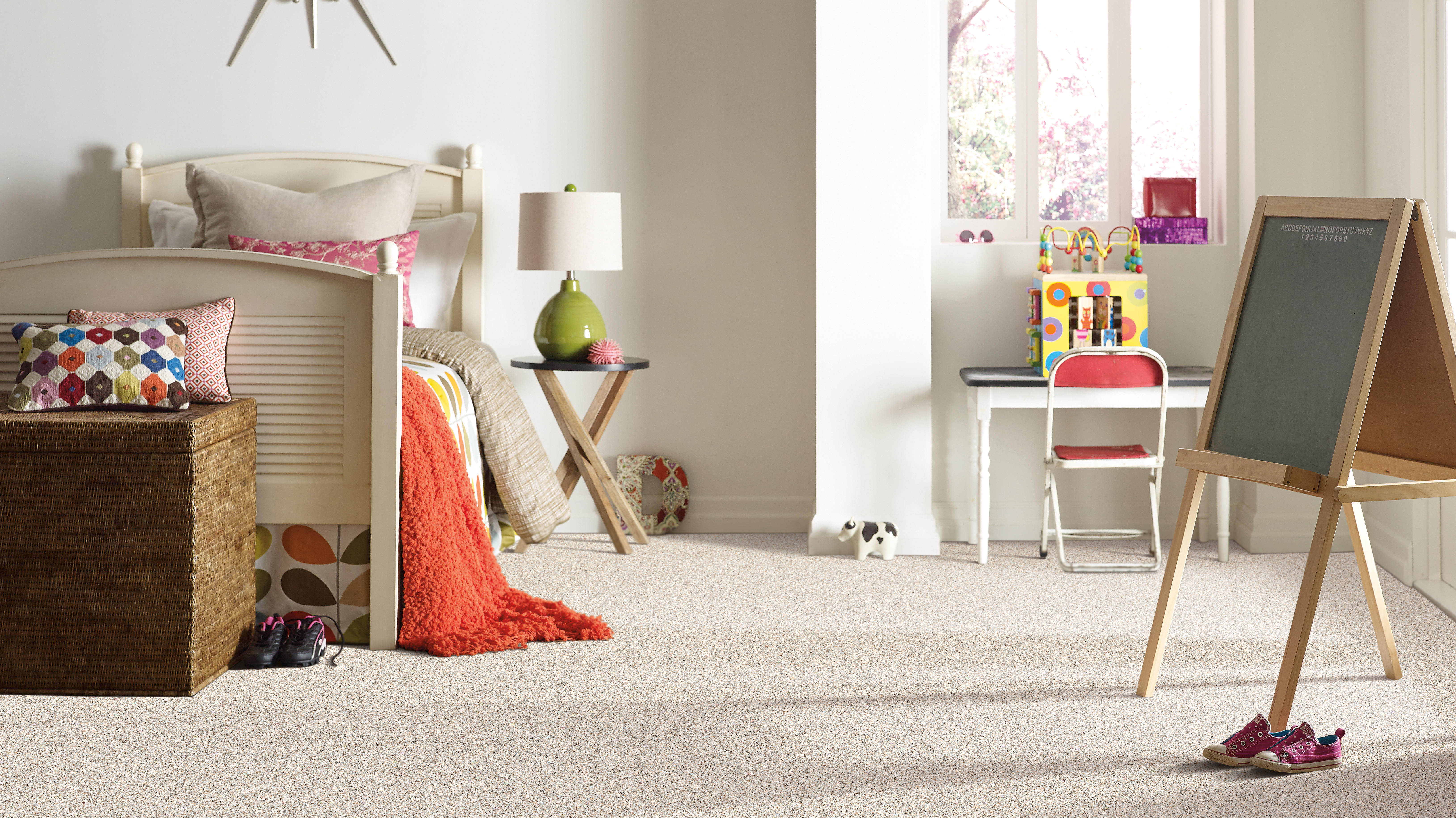 Carpet flooring in a kid's bedroom room, installation services available.