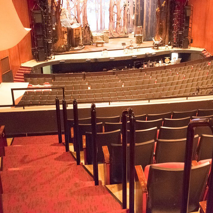 Commercial theater interior with bright red carpet