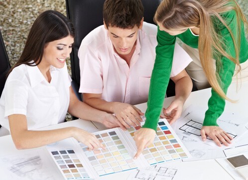 Three designers working together and picking out a color