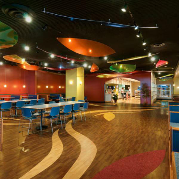 Fun restaurant interior with wood-look floors and colorful ceiling