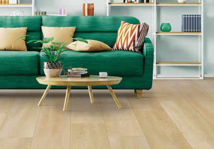 Tan laminate living room scene with bright green couch