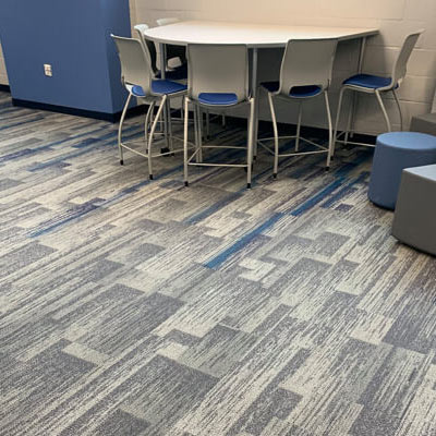 Commercial room scene with blue and gray patterned carpet