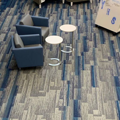 Commercial room scene with blue and gray patterned carpet