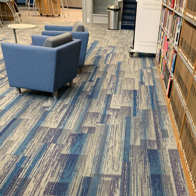 Commercial room scene with blue and gray patterned carpet